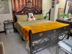 iron king size bed with springs mattress and 2 side table