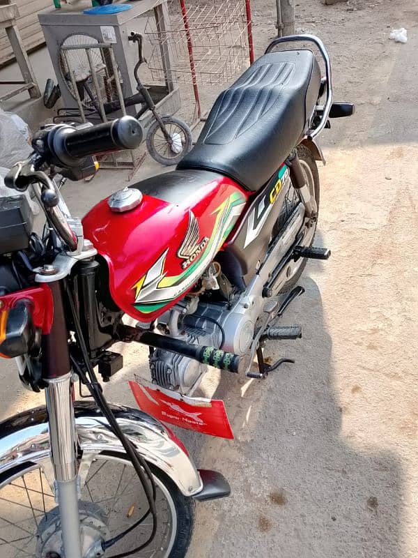 Honda CD 70cc Red 2023 condition 10/10  documents ok koi fault ni hy 2