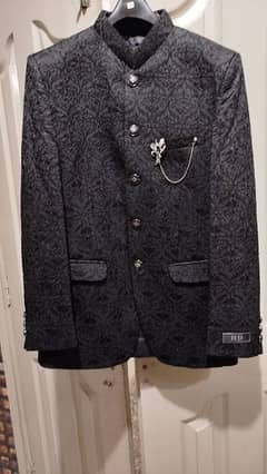 black fashion coat with broach