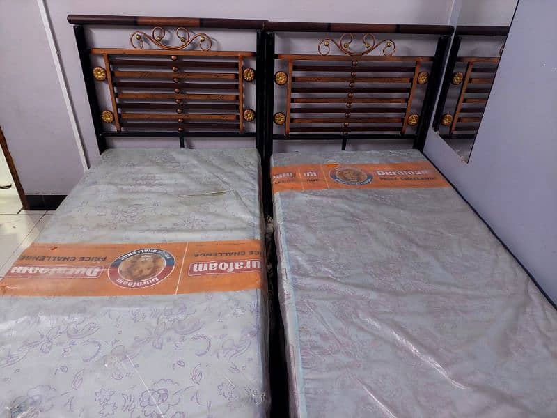 2 single beds, unused, and even plastic of mattress not removed yet 0