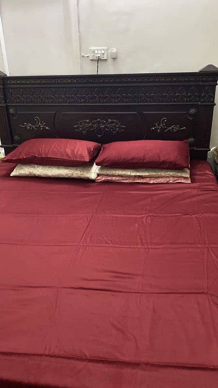 king size bed with two side tables and dressing table 0