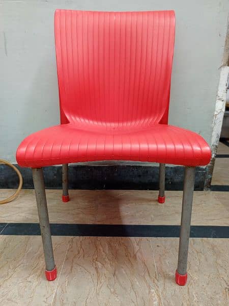 red plastic chair 1