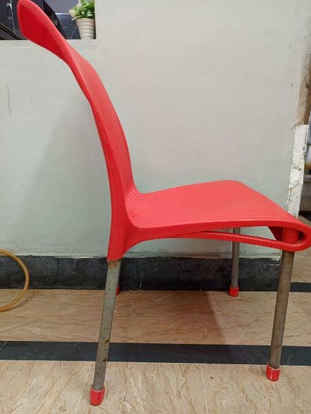 red plastic chair 2