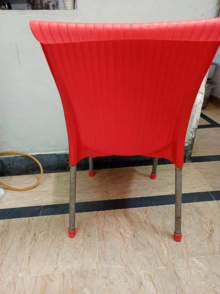 red plastic chair 3