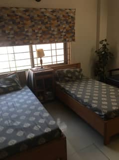 2 single beds with center table