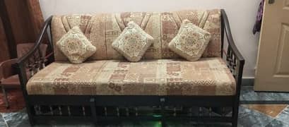 wooden sofa with cushions