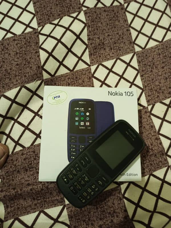 Nokia 105 with box and charger 0