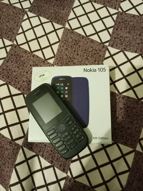 Nokia 105 with box and charger 2