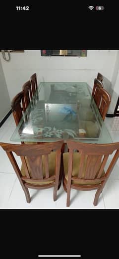 wodden dining  table with 8 chairs and  glass table