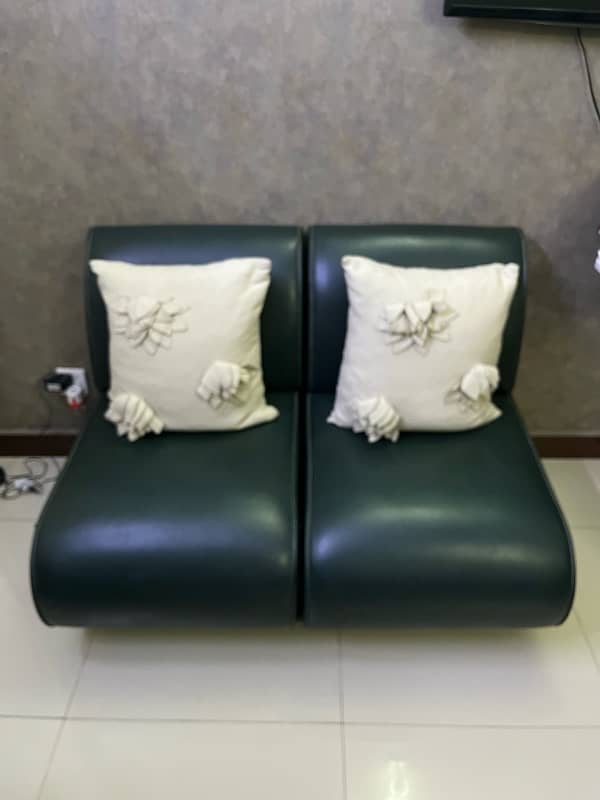 Single seater sofas (x2) with cushins 0