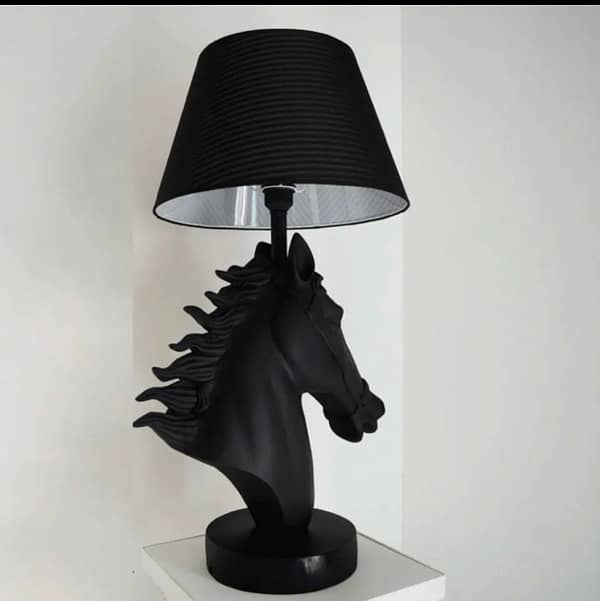 beautiful horse face lamps in matte black. 0