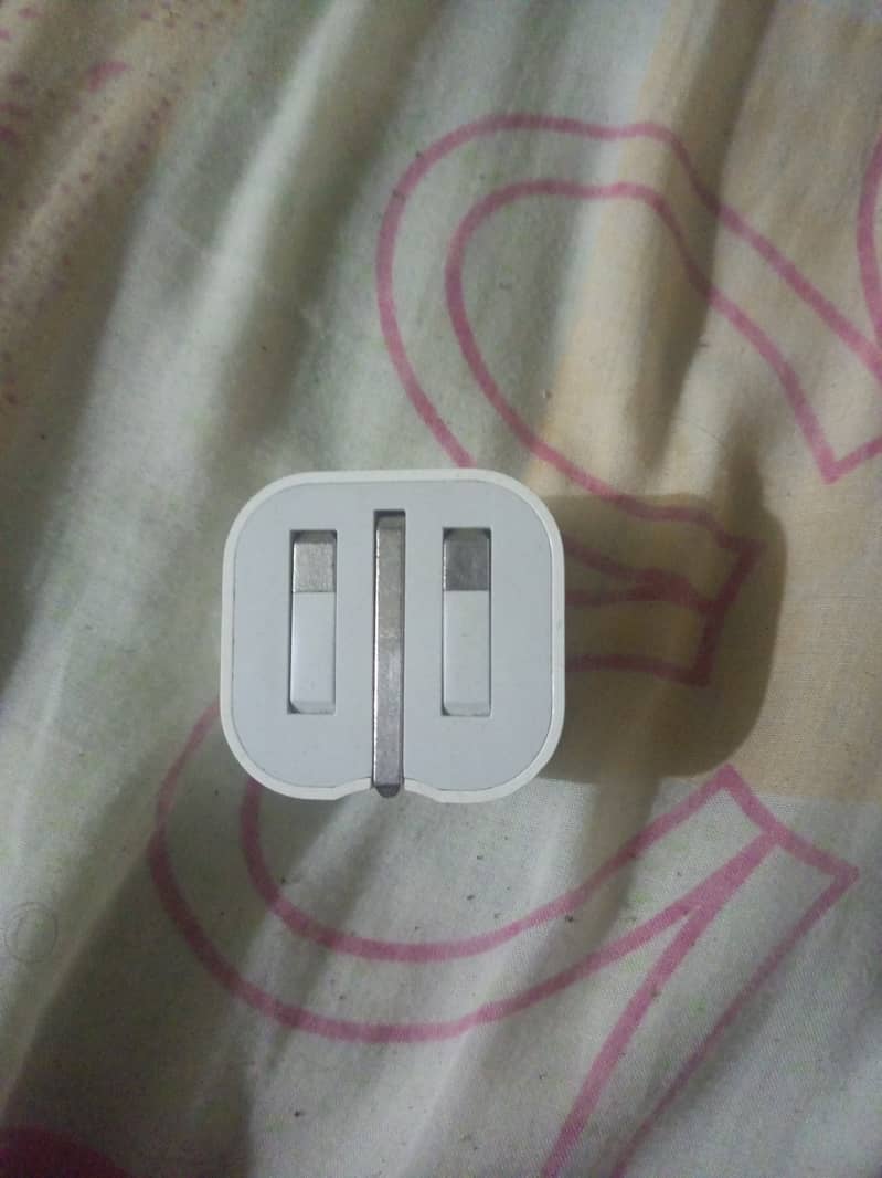 The iPhone has an original charger. 1