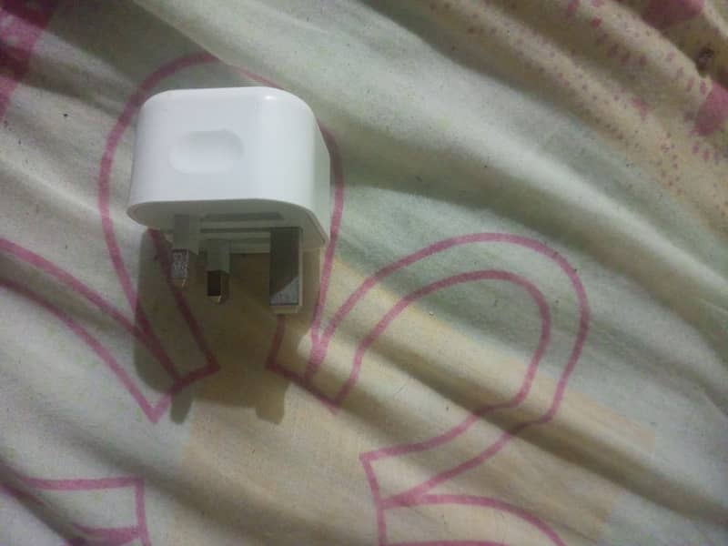 The iPhone has an original charger. 3