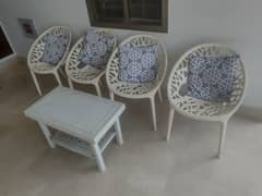 Plastic PVC chairs with table and wooden chairs