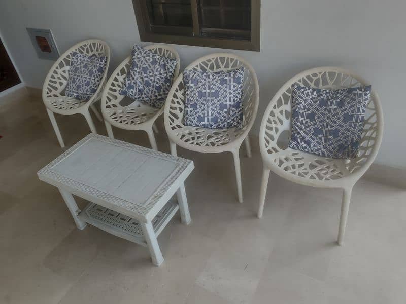 Plastic PVC chairs with table and wooden chairs 0