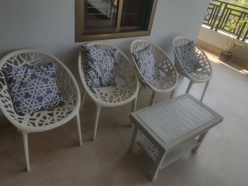 Plastic PVC chairs with table and wooden chairs 1