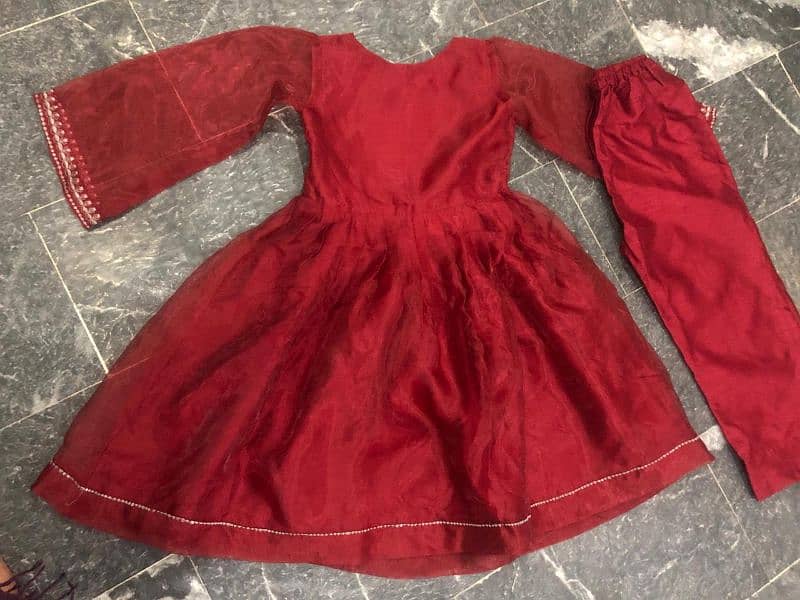 organza frock in reddish mehroon color in good condition 0