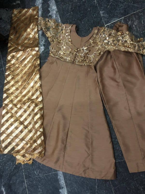 kartaan silk frock golden in color use only 1 time 2