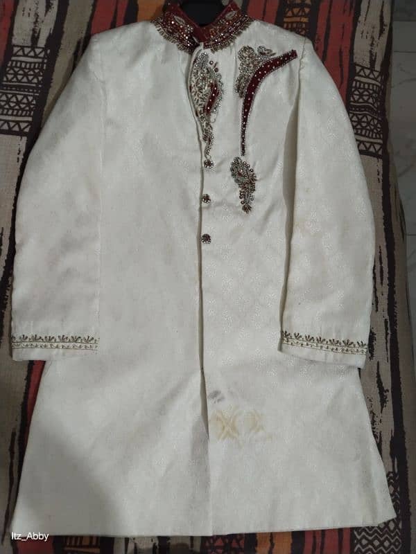 Elegant White Sherwani with Red and Gold Embroidery. 0