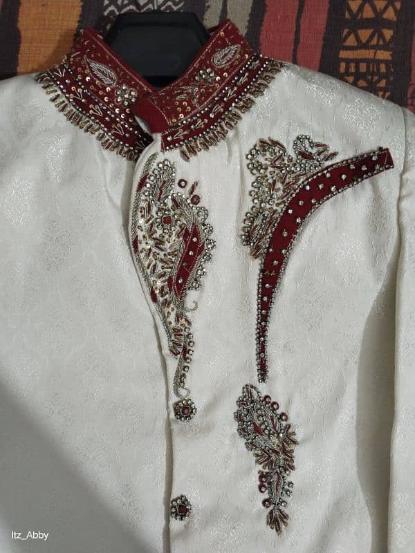 Elegant White Sherwani with Red and Gold Embroidery. 1