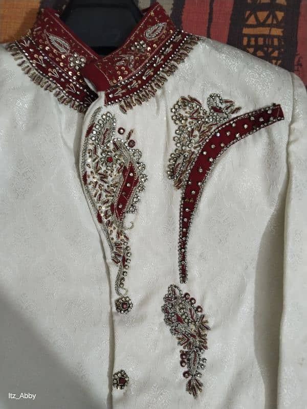 Elegant White Sherwani with Red and Gold Embroidery. 2