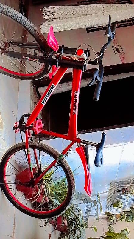 Maroon ferrari hybrid bicycle with premium design 1