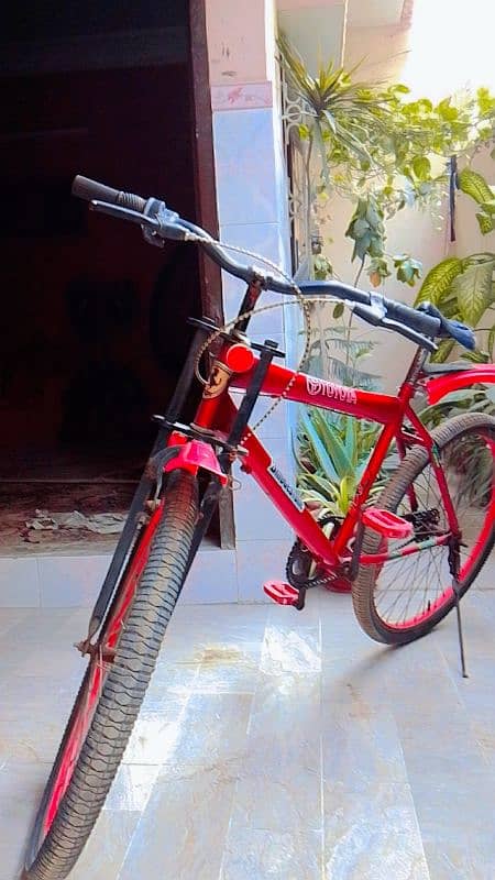 Maroon ferrari hybrid bicycle with premium design 2