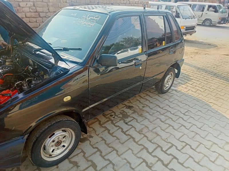 Suzuki Mehran VX 2012 yellow scheme 0