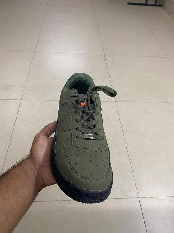 olive green Nike jordans 1