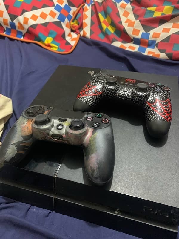 ps4 fat 500 gb with 2 controller and 9 game cds 0