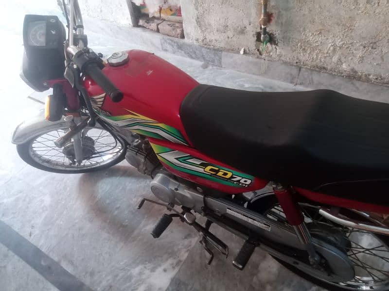 Honda 70 cc. red colour good condition all documents complete 4