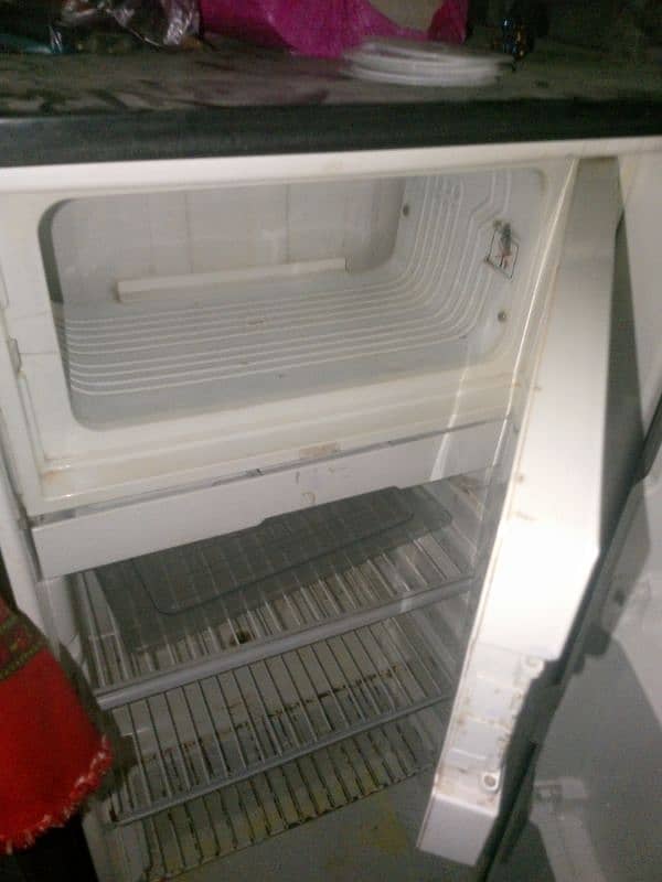 Dawlance small refrigerator for sale . like new condition. 100%working. 2