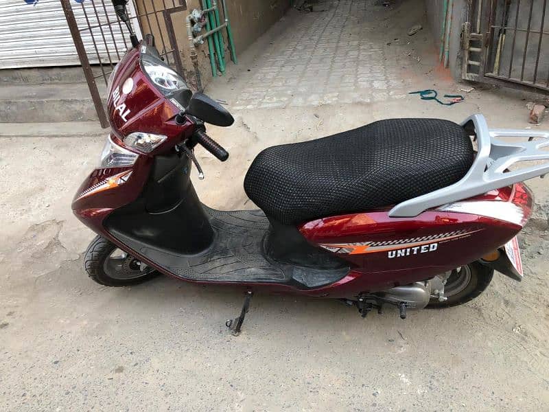 united 100cc petrol scooty 2024 0