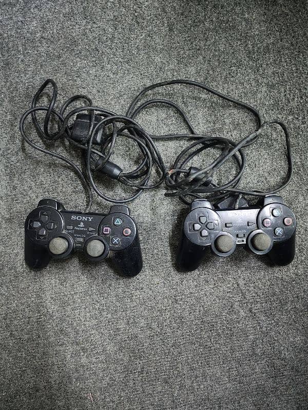 PlayStation 2 (PS 2) with 2 Controllers 2