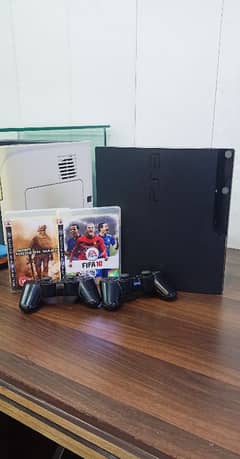 PS3 Slim 10/10 condition with original controllers and wires