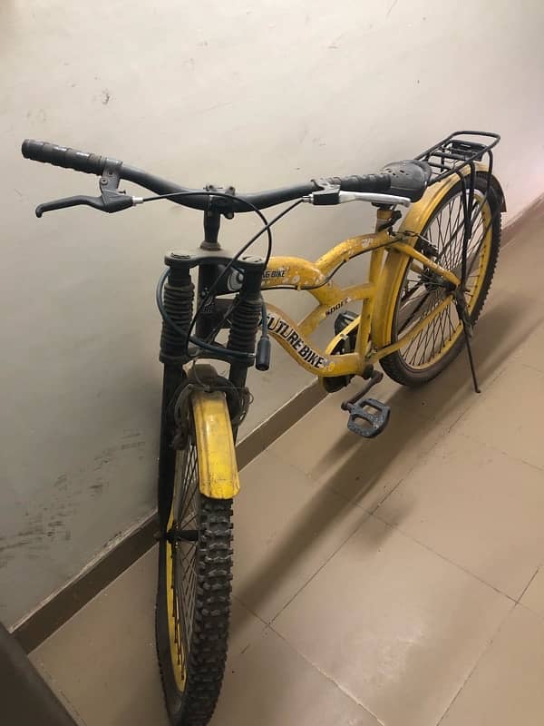 very beautiful bycycle in yellow clr sports type with shocks for sale 2