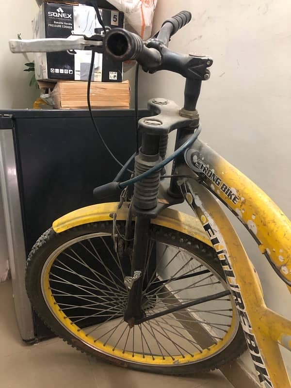 very beautiful bycycle in yellow clr sports type with shocks for sale 3