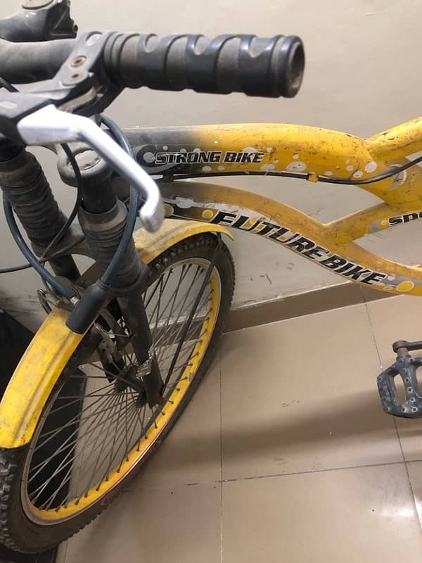 very beautiful bycycle in yellow clr sports type with shocks for sale 4