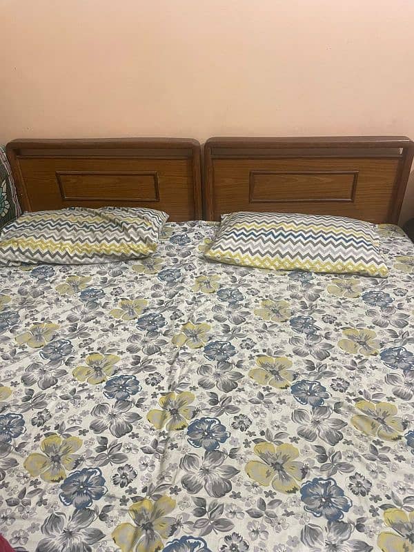 Two single beds with mattresses 1