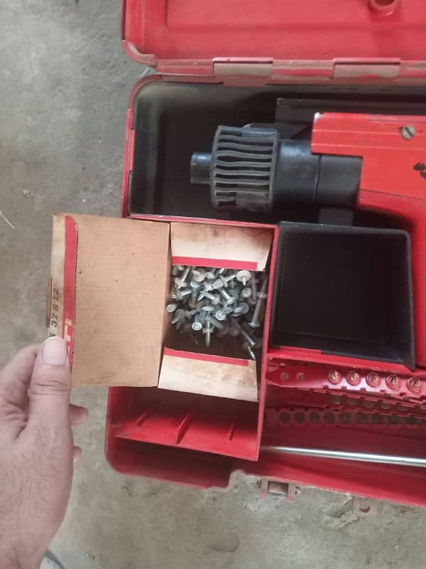 Hilti DX 450 drill machine and a used Table Fan 1