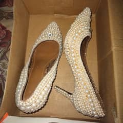 Hand work on heels with pearls