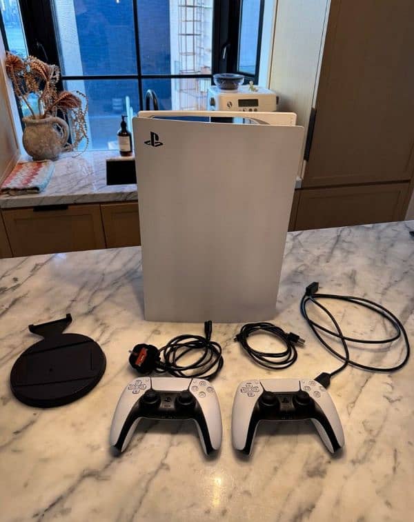 PS5 digital edition, almost new with two controls 0