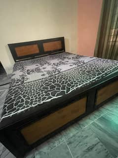 Wooden bed  with mattress (good condition) is for sale. 0333-5129529