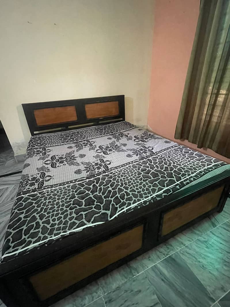 Wooden bed  with mattress (good condition) is for sale. 0333-5129529 1