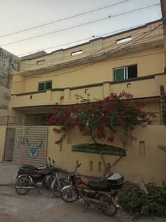 10 Marla Double Storey House For Sale Razaq Town Chakra Road.