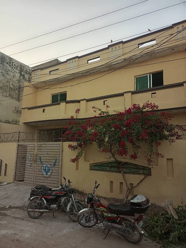 10 Marla Double Storey House For Sale Razaq Town Chakra Road. 11