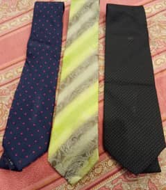 A bunch of men ties of different brands  Exist- Uniworth- Figure peeru