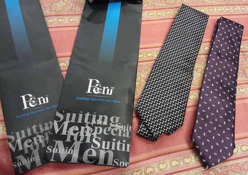 A bunch of men ties of different brands  Exist- Uniworth- Figure peeru 5