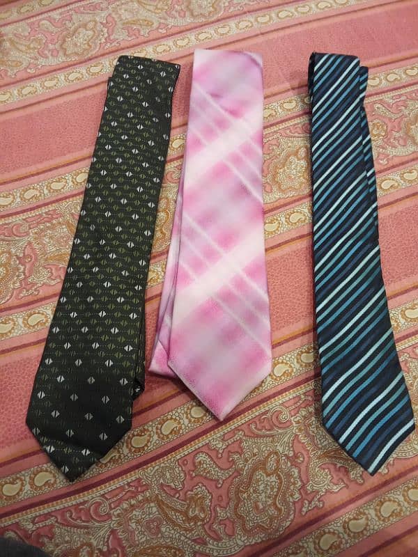 A bunch of men ties of different brands  Exist- Uniworth- Figure peeru 6