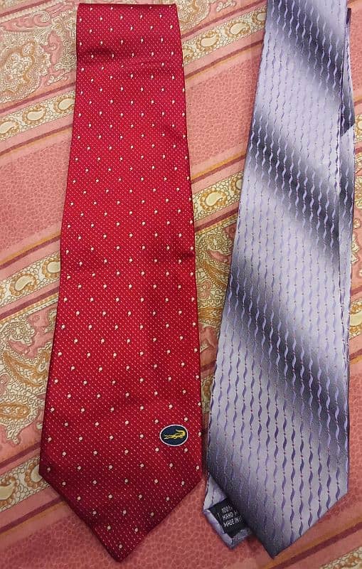 A bunch of men ties of different brands  Exist- Uniworth- Figure peeru 8